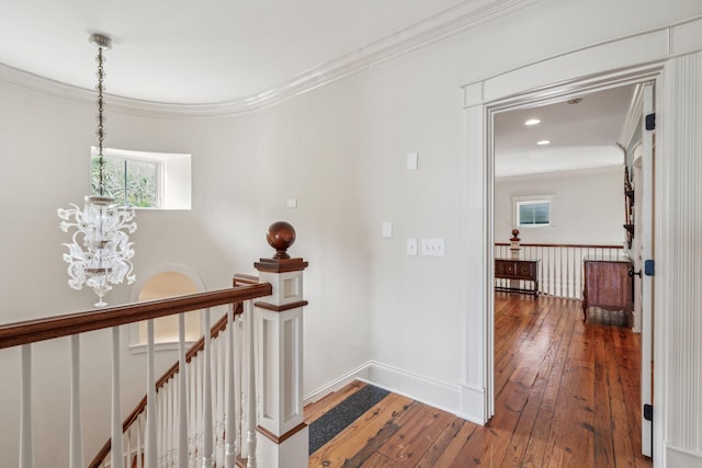 104 Beach St, Mount Pleasant, SC 29464 - hallway featuring hardwood / wood-style floors, ornamental molding, a chandelier, healthy amount of natural light, and an upstairs landing