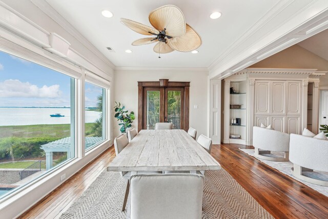 104 Beach St, Mount Pleasant, SC 29464 - dining room with hardwood / wood-style floors, a water view, ceiling fan, recessed lighting, and crown molding