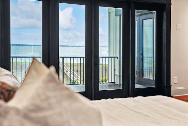 104 Beach St, Mount Pleasant, SC 29464 - bedroom featuring a water view, access to exterior, baseboards, and french doors