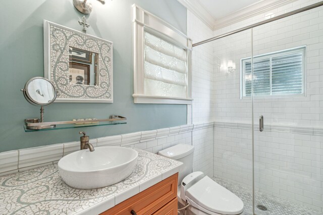 104 Beach St, Mount Pleasant, SC 29464 - bathroom featuring a shower stall, toilet, vanity, crown molding, and tile walls