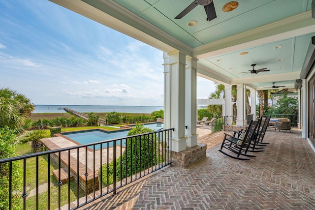104 Beach St, Mount Pleasant, SC 29464 - view of patio with a ceiling fan, a water view, and an outdoor pool