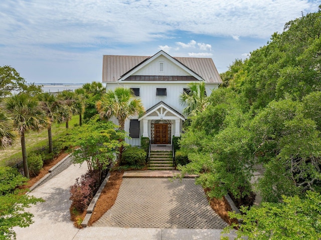 104 Beach St, Mount Pleasant, SC 29464 - view of front of house with metal roof, board and batten siding, and a standing seam roof