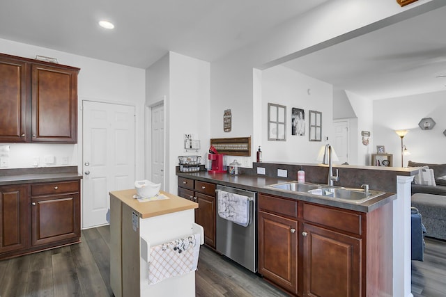 kitchen with a center island, dark wood finished floors, open floor plan, dishwasher, and a sink