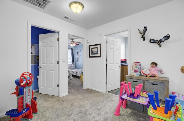 playroom featuring visible vents, carpet flooring, and baseboards