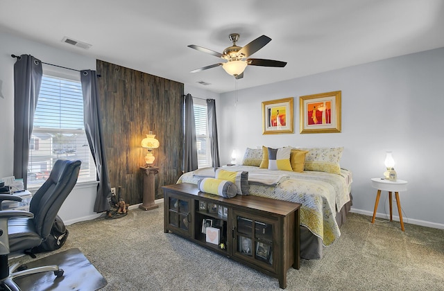 bedroom featuring visible vents, carpet flooring, baseboards, and ceiling fan