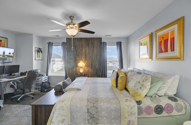 bedroom featuring visible vents and ceiling fan