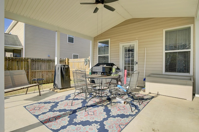 view of patio / terrace featuring outdoor dining space, fence, and ceiling fan