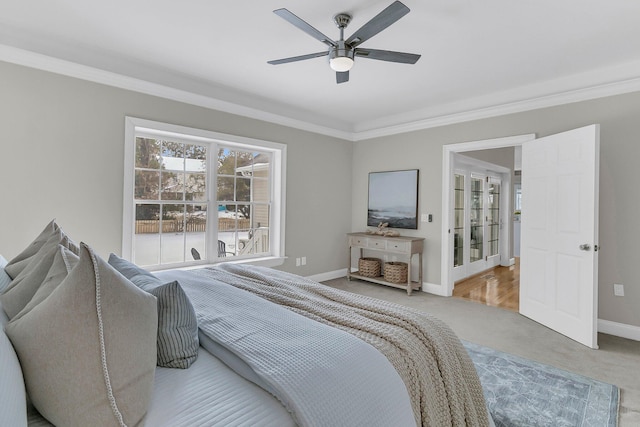 bedroom with crown molding, ceiling fan, and carpet flooring