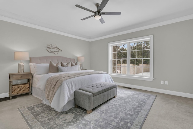 bedroom featuring crown molding, ceiling fan, and carpet flooring