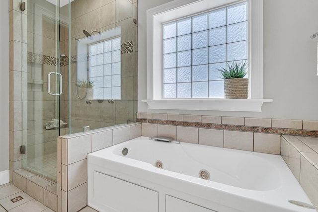 bathroom with tile patterned flooring and plus walk in shower