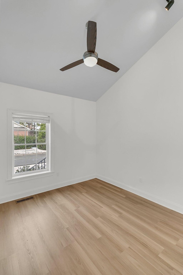 spare room with light hardwood / wood-style floors and ceiling fan