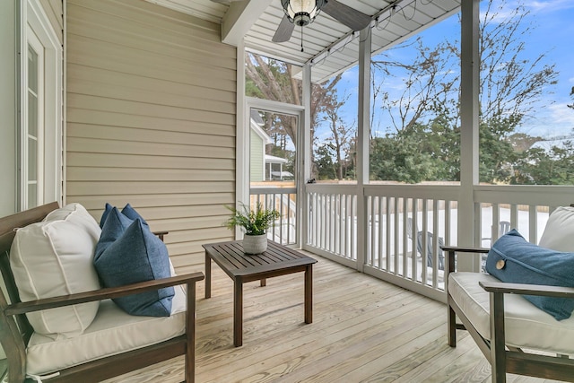 sunroom / solarium with a wealth of natural light and ceiling fan