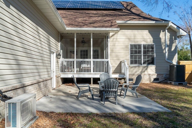 view of patio featuring ac unit, central AC, and ceiling fan