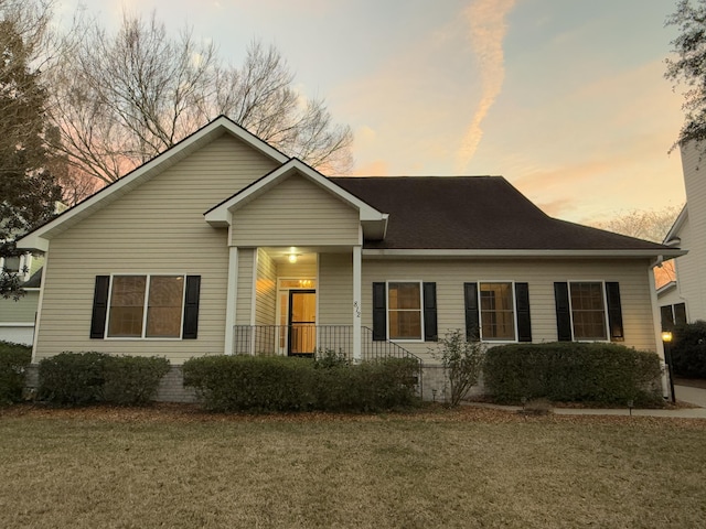 view of front of house with a lawn