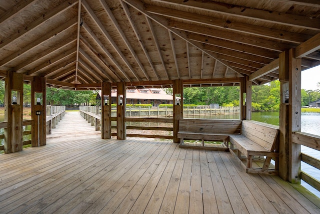 wooden deck featuring a water view