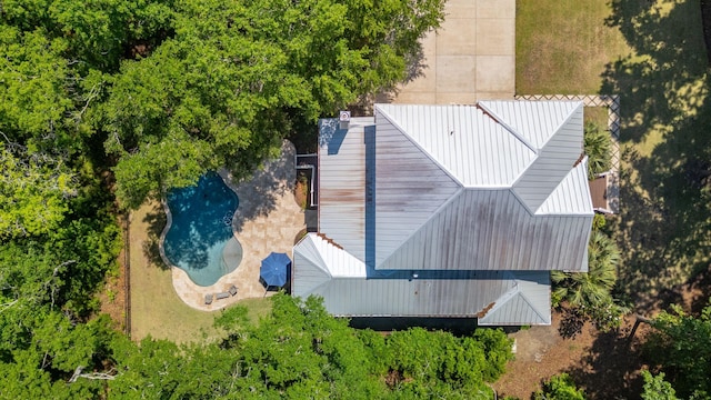view of subject property with a pool area