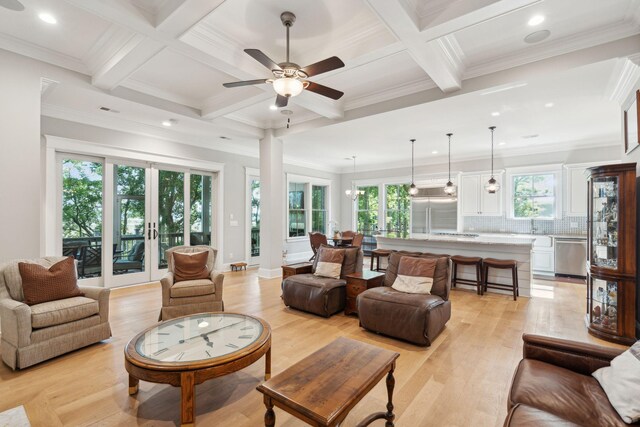 living area with coffered ceiling, beamed ceiling, recessed lighting, light wood-type flooring, and ceiling fan