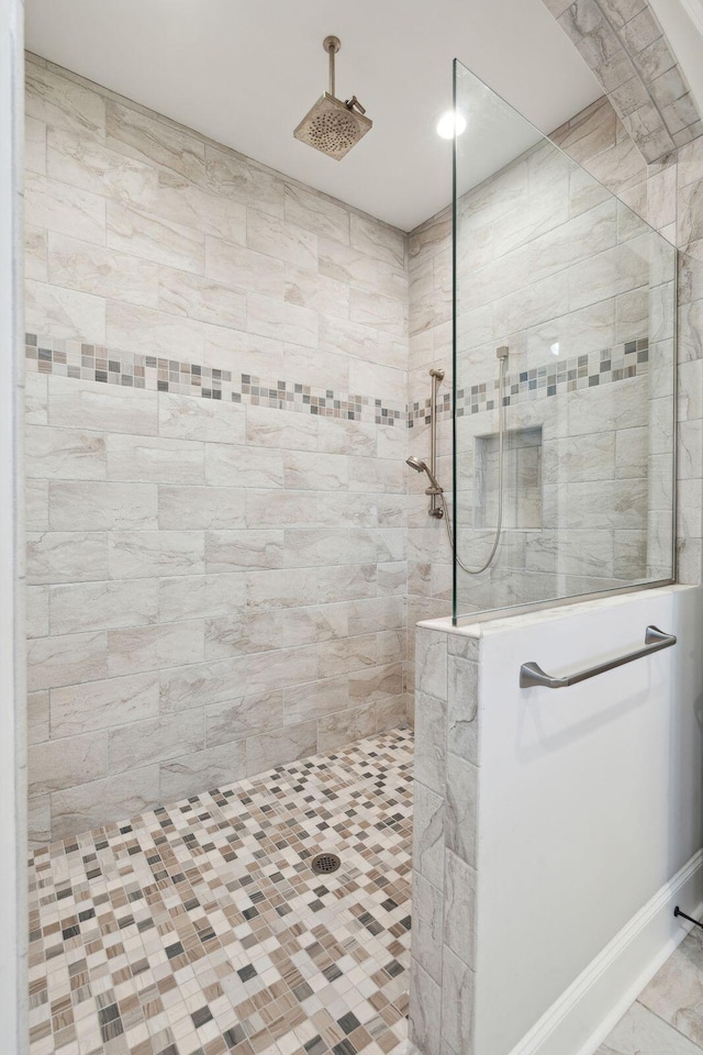 bathroom with a walk in shower and recessed lighting