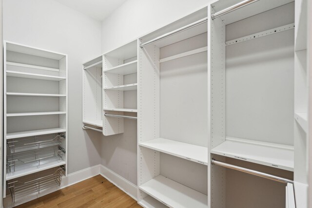 spacious closet with wood finished floors