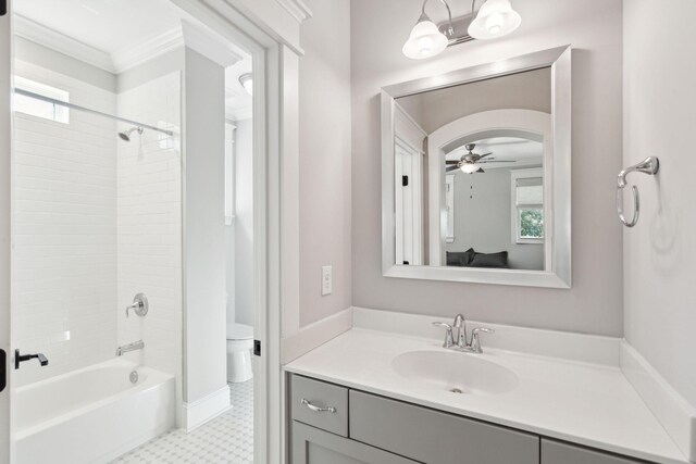bathroom featuring toilet, vanity, ceiling fan, ornamental molding, and tile patterned floors