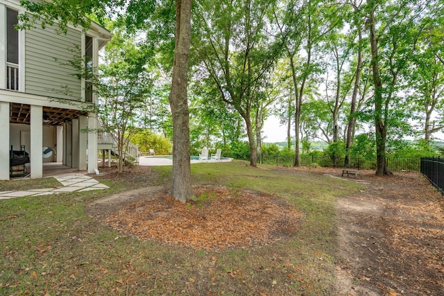 view of yard featuring stairs, fence, and a patio