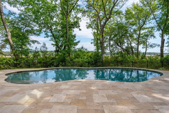 view of pool featuring a patio area and fence