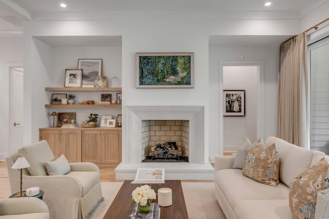 living room with ornamental molding and light wood-type flooring