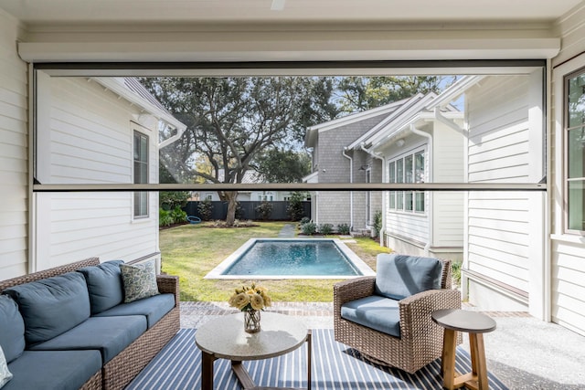 view of pool with outdoor lounge area, a yard, and a patio area