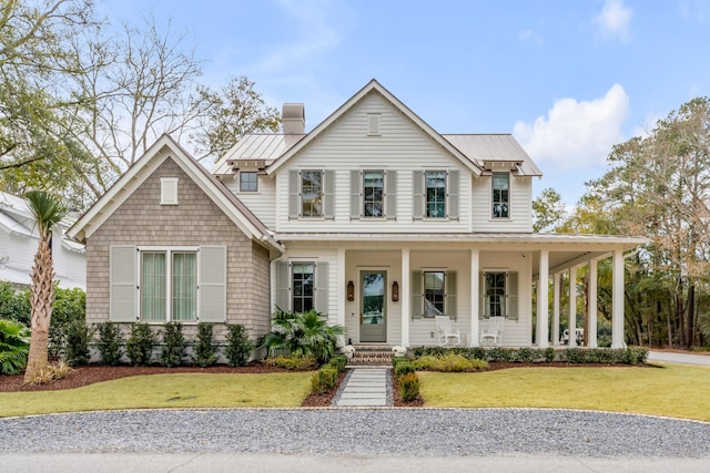 view of front facade with a front lawn and a porch