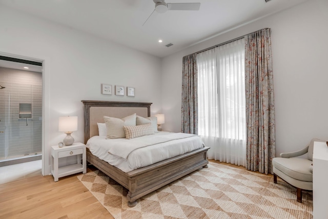 bedroom with light hardwood / wood-style floors and ceiling fan