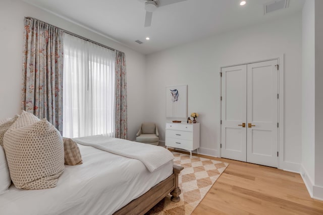 bedroom featuring ceiling fan and light hardwood / wood-style floors