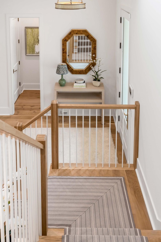 stairs featuring wood-type flooring