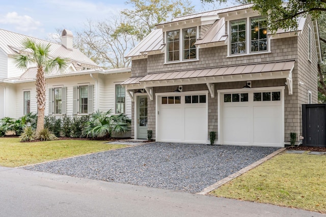 view of front of home featuring a garage and a front lawn