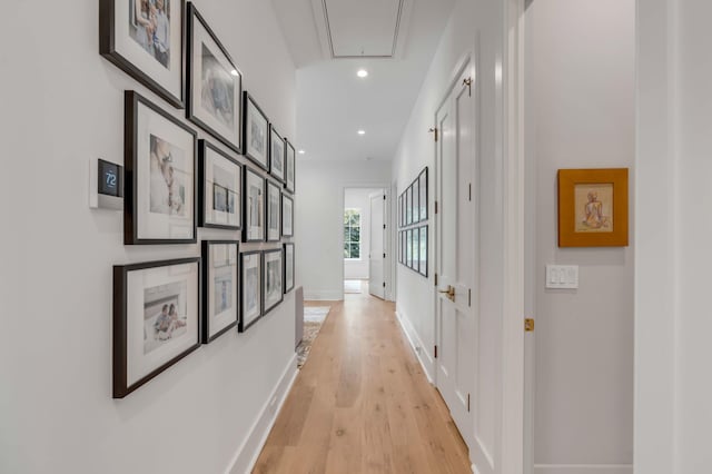 hallway with light hardwood / wood-style floors