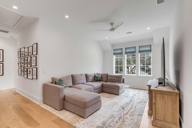 living room featuring ceiling fan and light hardwood / wood-style flooring