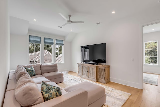 living room featuring ceiling fan and light wood-type flooring