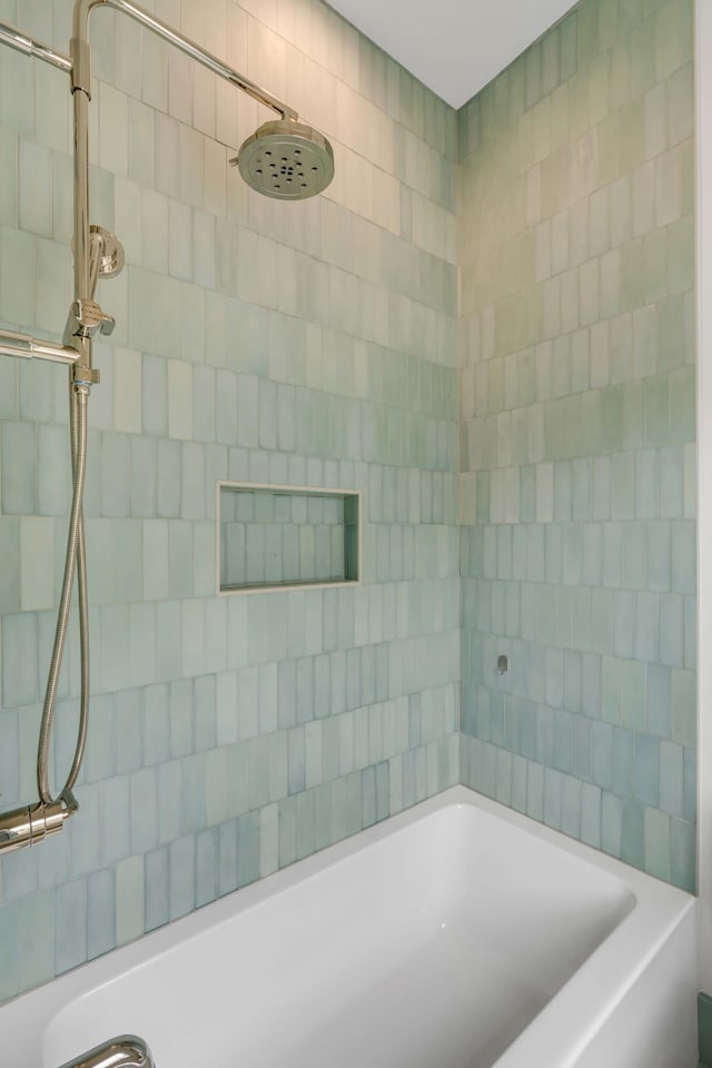 bathroom with a tile shower