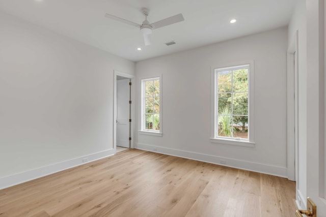 unfurnished room with ceiling fan and light wood-type flooring