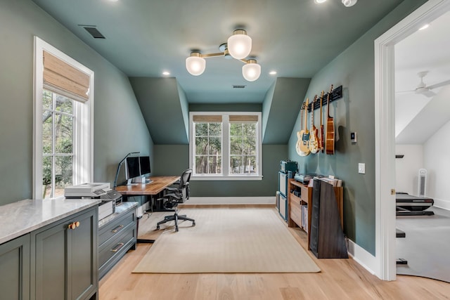 office space featuring light hardwood / wood-style flooring, ceiling fan, and plenty of natural light