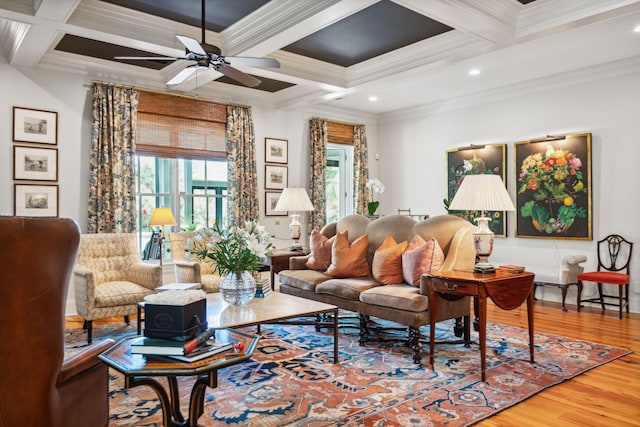 living room featuring beam ceiling, a ceiling fan, ornamental molding, wood finished floors, and coffered ceiling