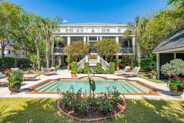 pool featuring stairs and a patio