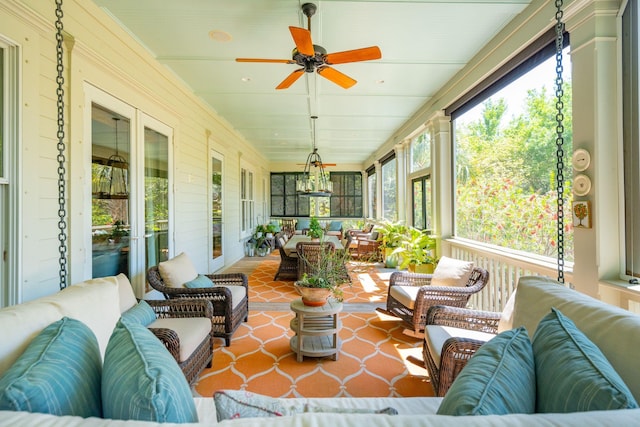 sunroom / solarium with a ceiling fan