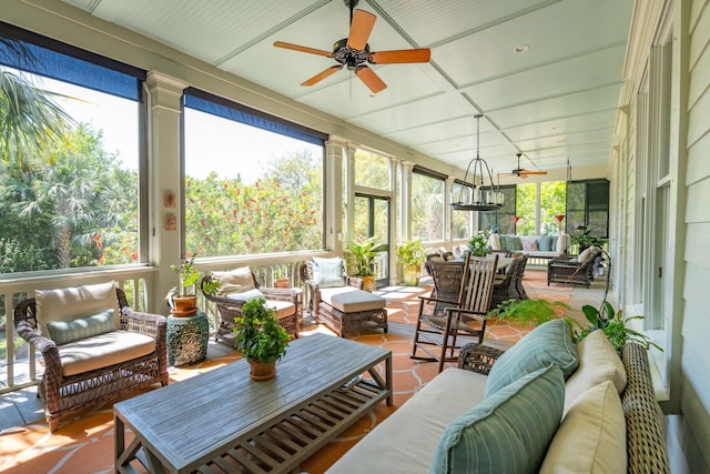 sunroom featuring ceiling fan