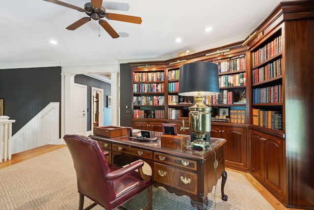 office with ornamental molding, ceiling fan, light wood-style flooring, and ornate columns