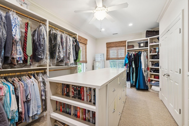 walk in closet featuring ceiling fan and light colored carpet