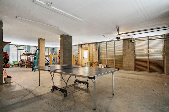 recreation room featuring concrete floors