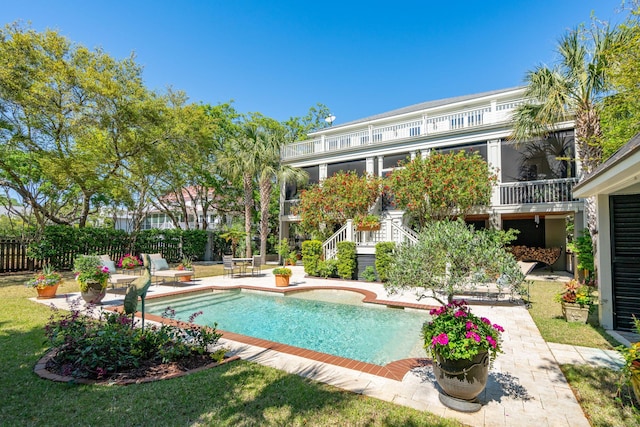 view of pool with a patio area, stairway, fence, and a fenced in pool