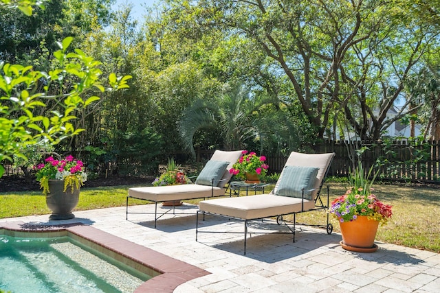 view of patio / terrace featuring fence and a fenced in pool