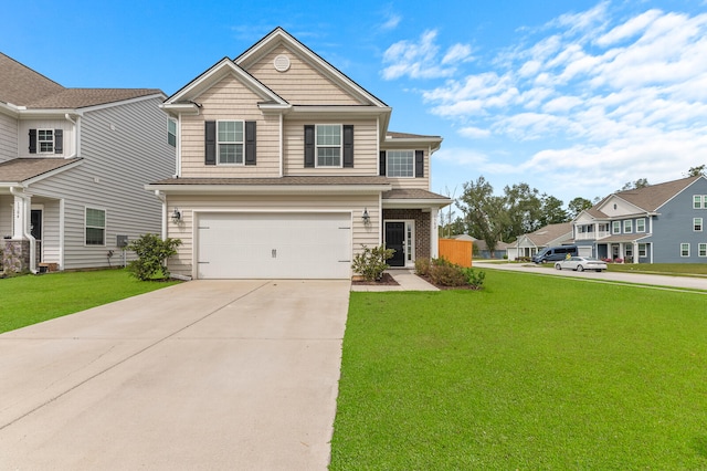 view of front of home featuring a garage and a front lawn