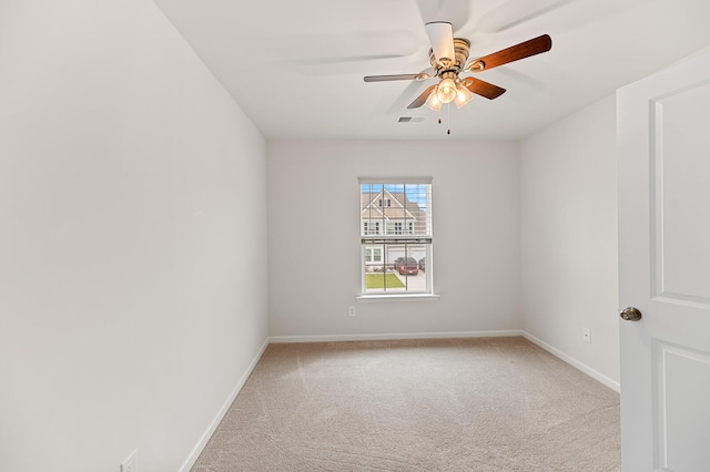 carpeted empty room with ceiling fan